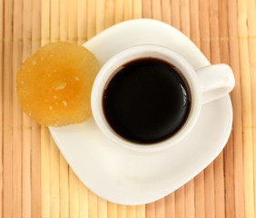 Cup of coffee on brown background
