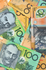 Australian currency background, notes include $100 and $50