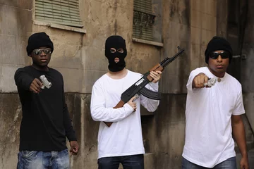 Foto op Aluminium Gang members with guns and rifle on the street © mangostock