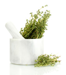 mortar with fresh green thyme isolated on white
