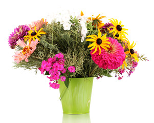 Beautiful bouquet of bright flowers in pail isolated on white