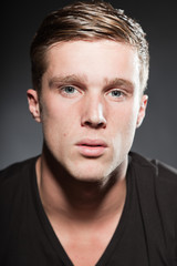 Obraz premium Fashion beauty portrait of young man with short brown hair.