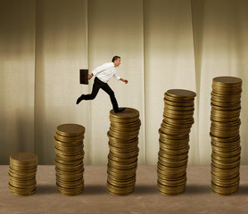 Jumping businessman on money
