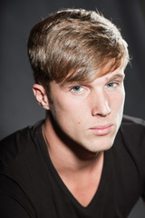Obraz premium Fashion beauty portrait of young man with short brown hair.