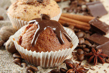 tasty muffin cakes with chocolate, spices and coffee seeds,