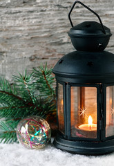 Burning lantern with fir branch