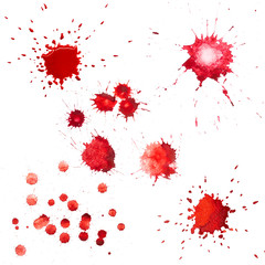 Red blots of watercolor paint