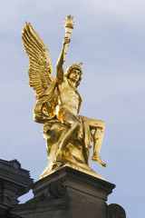 Fototapeta na wymiar Sitting golden statue