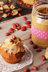 Delicious peanut butter in jar with baking