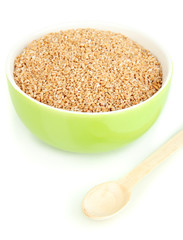 Green bowl full of wheat bran isolated on white