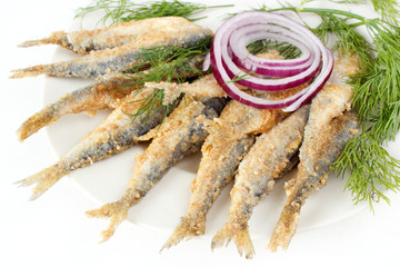 Roasted and breaded vendace fish on dish