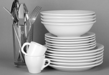 Clean white dishes on grey background