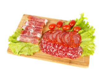 Sliced meat snack with some salad on white background