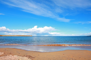 Beautiful sandy beach with seawaves in St Andrews