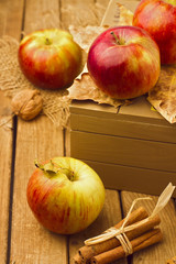 Still life with fresh apples and wooden box.