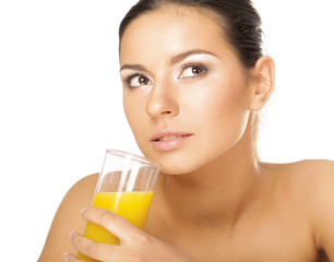 A young woman drinking orange juice