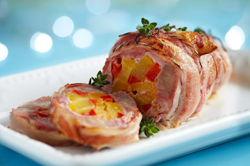 Bacon wrapped pork with pineapple and pepper