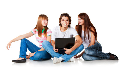 three students and laptop