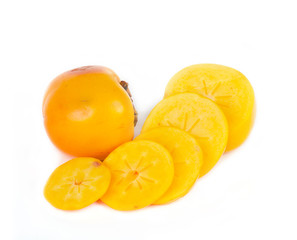 sweet ripe persimmon with slices on white background