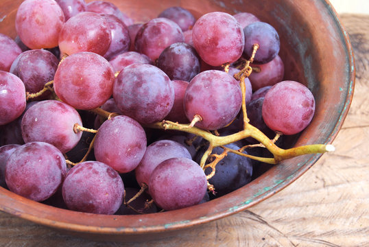 Bunch of grapes on rustic background