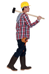 Young worker with a sledgehammer