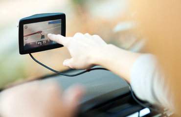 Woman using GPS in car