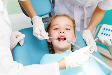 Little girl visiting dentist