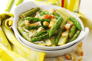 Asparagus baked with cheese and lemon peel.