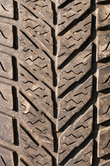 Very old used black tyre macro photo