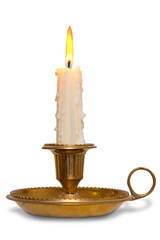 Candle in brass chamberstick holder isolated - 46784871