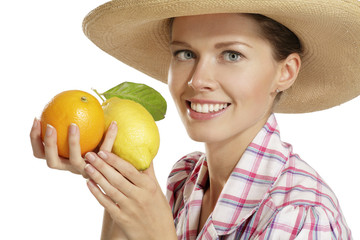 Fototapeta premium young woman showing citrus