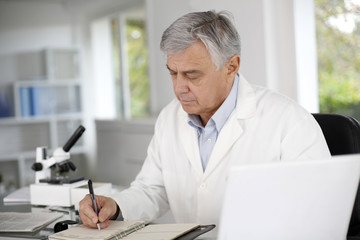Doctor in biology writing report on agenda
