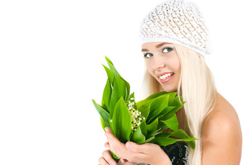 blond girl with a bouquet of lilies of the valley