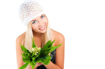 blond girl with a bouquet of lilies of the valley