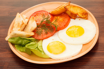 fried eggs with vegetables
