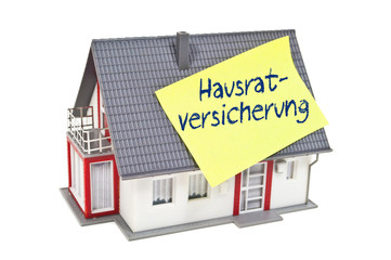 Haus mit Zettel und Hausratversicherung