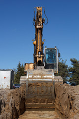 excavators digging sewer trench