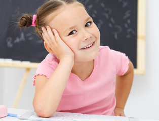Portrait of a little girl in school