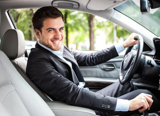 Handsome man driving his car