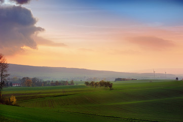 Misty sunset,golden sunbeam shine through the Deister.