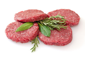raw hamburgers isolated on white background