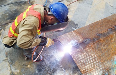 welder repair steel on Hon Kong street