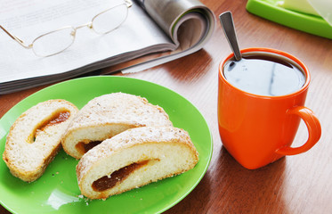 Cup of coffee and bun with jam for lounch
