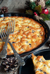 Pie with Apples from Eggs  on Wooden Table Decorated with Pine C