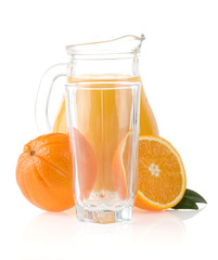 orange fruit and  juice in glass and jug