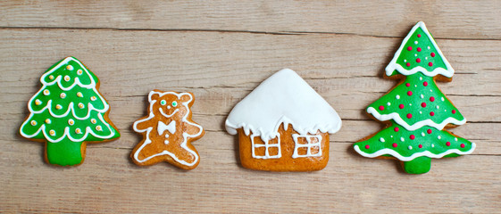 Christmas homemade gingerbread cookies over wooden table