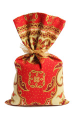 Sachet décoratif oriental rouge et doré isolé sur le fond blanc