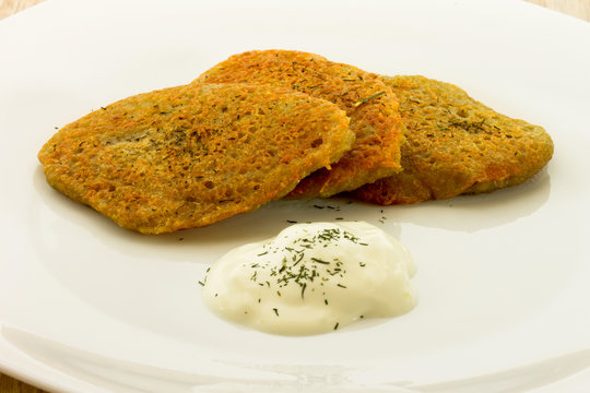 Homemade potato pancaces isolated on white plate