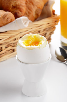 Boiled egg, orange juice, croissants