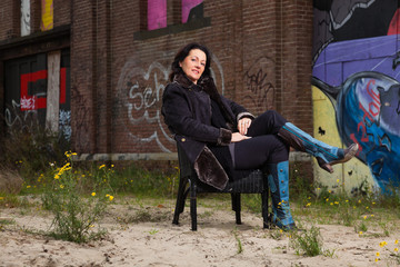 Urban fashion portrait of pretty woman with black hair.